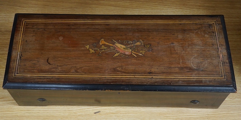 A late 19th century Swiss cylinder music box, by Paillard Vaucher Fils, initialled PVF, 55.5cm wide, 20.5cm deep. Condition - in working order but casing in need of restoration and mechanics in of need cleaning